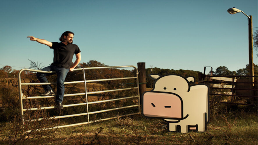 An image showing the developer of the game "Cow Clicker" and the main character in the game